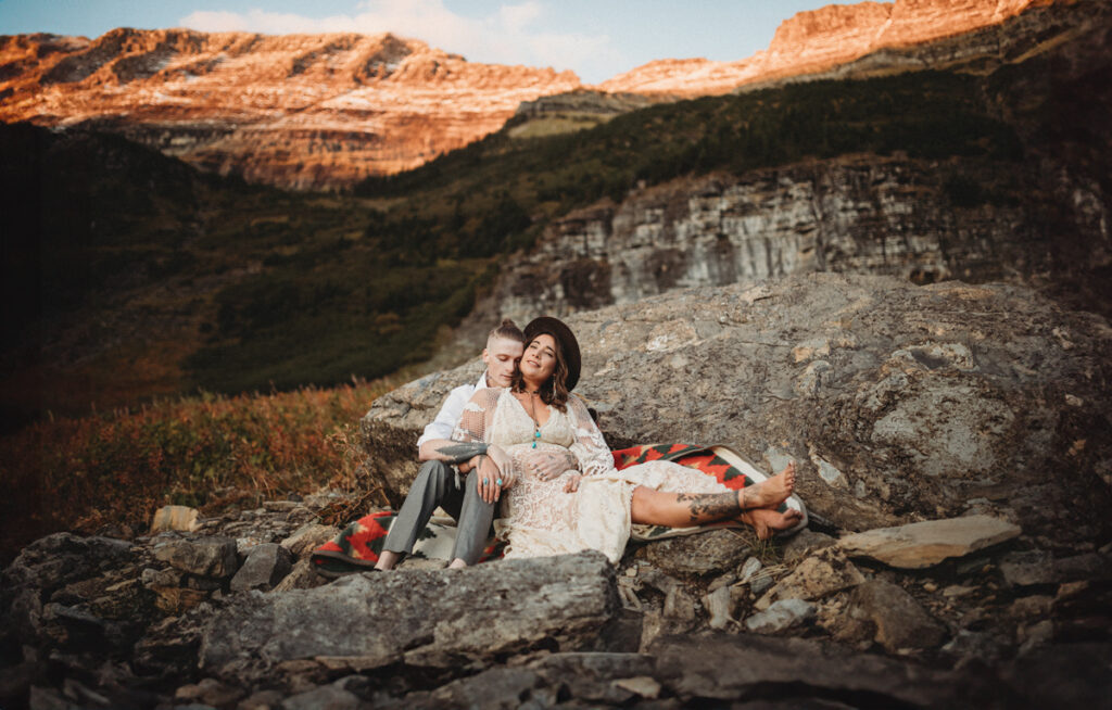 Glacier Elopement couple cuddling in the mountains.
